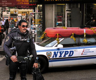 A police officer patrols Brooklyn in the new NYPD uniform.